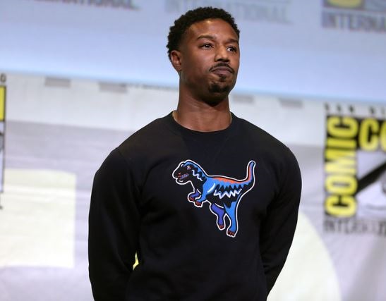 Michael B. Jordan wears a black sweatshirt at Comic Con